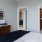 Bedroom with natural lighting and high ceilings