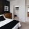 Bedroom with natural lighting and high ceilings